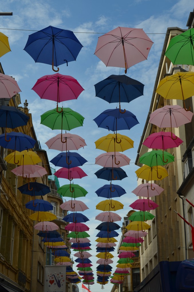 Pretty side street in Luxembourg. We don't know the umbrellas were covering it but they looked cool!